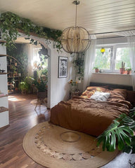 Let your bedroom bloom into a peaceful sanctuary with the soft presence of indoor plants