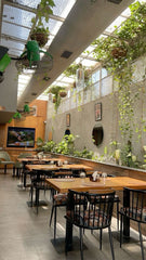 the café room is a peaceful haven, where the rich aroma of freshly brewed coffee