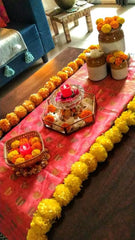 In the living room, elevate the festive spirit by arranging colorful flowers .