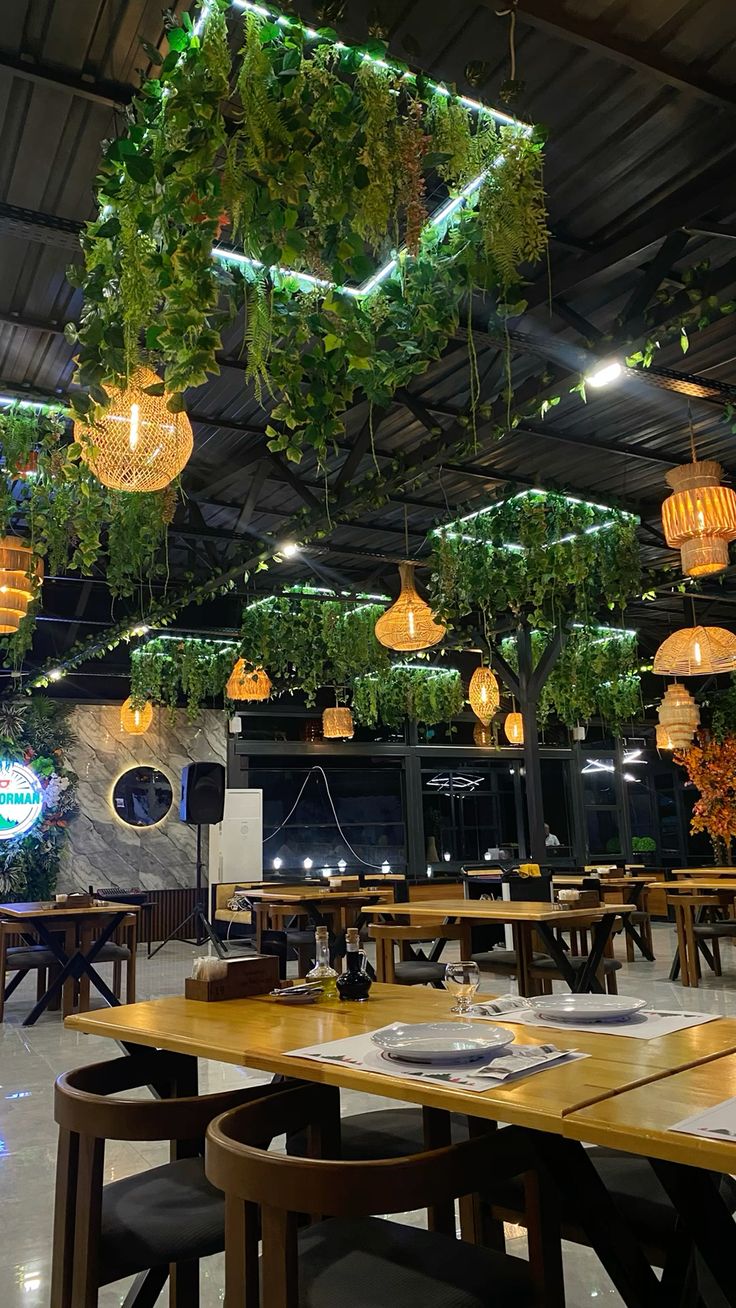 CAFE ROOM WITH GREENERY AND HANGING PLANTS