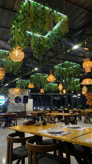 CAFE ROOM WITH GREENERY AND HANGING PLANTS