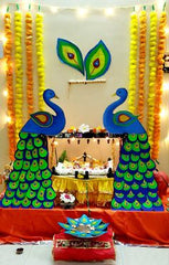 PEACOCK DECORATON,Ganpati decoration with plants brings a serene and sacred charm to the celebration.